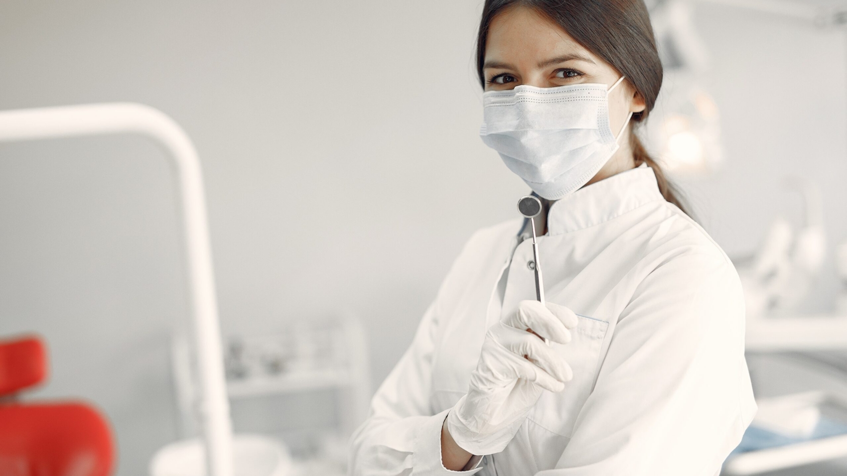 Beautiful dentist working on a dental clinic