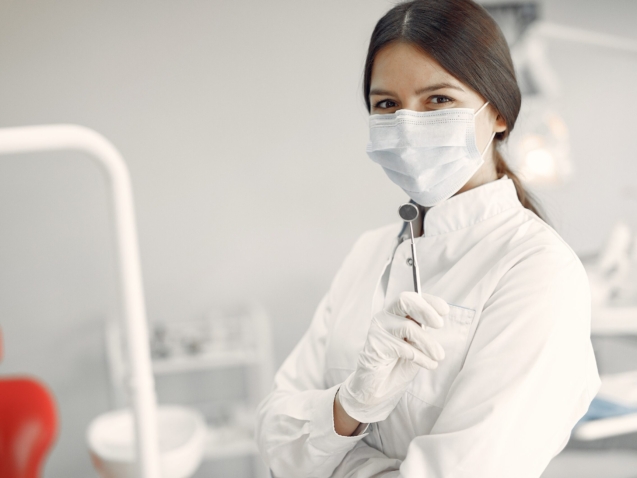 Beautiful dentist working on a dental clinic